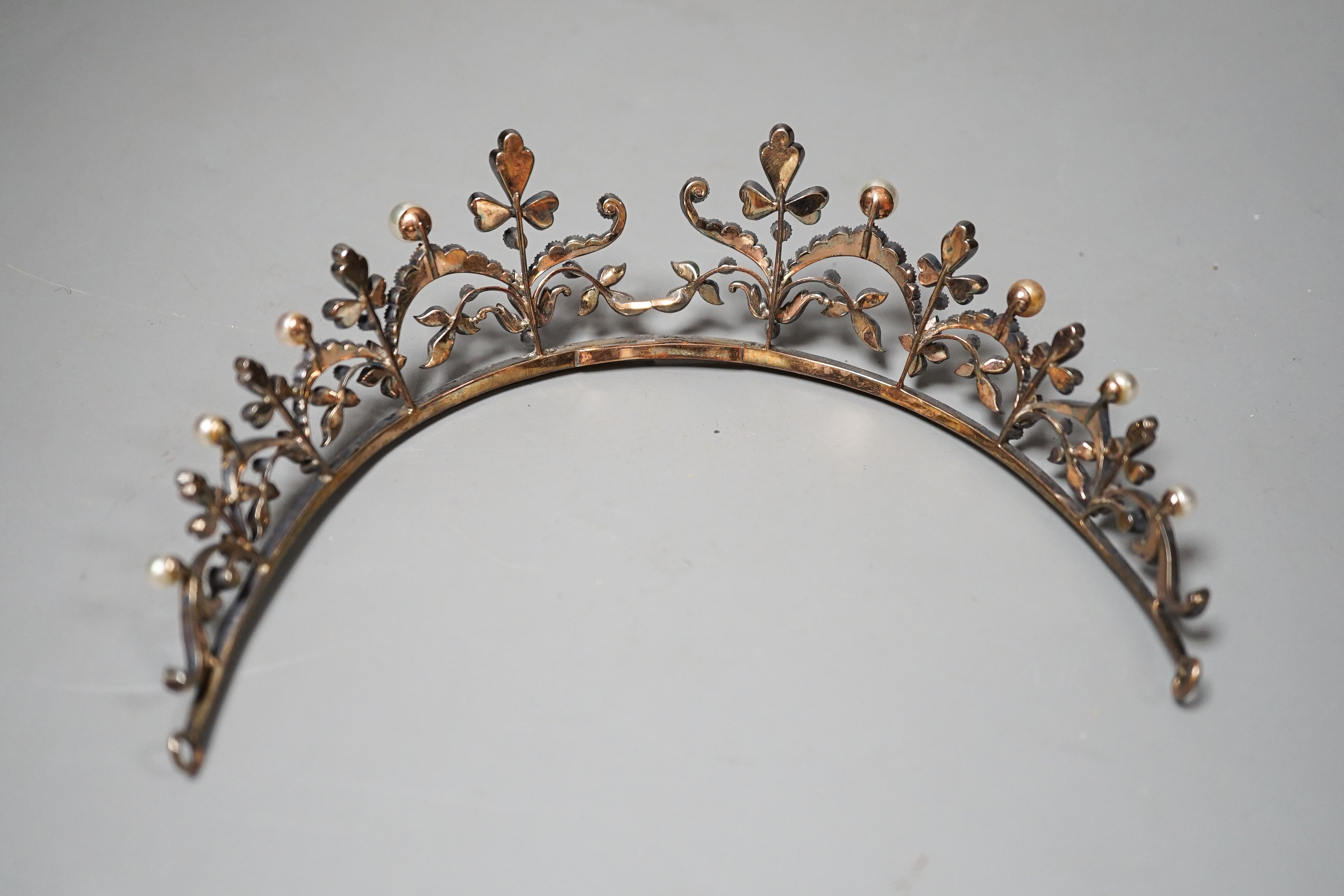 An Edwardian white metal and paste set tiara, 13cm.